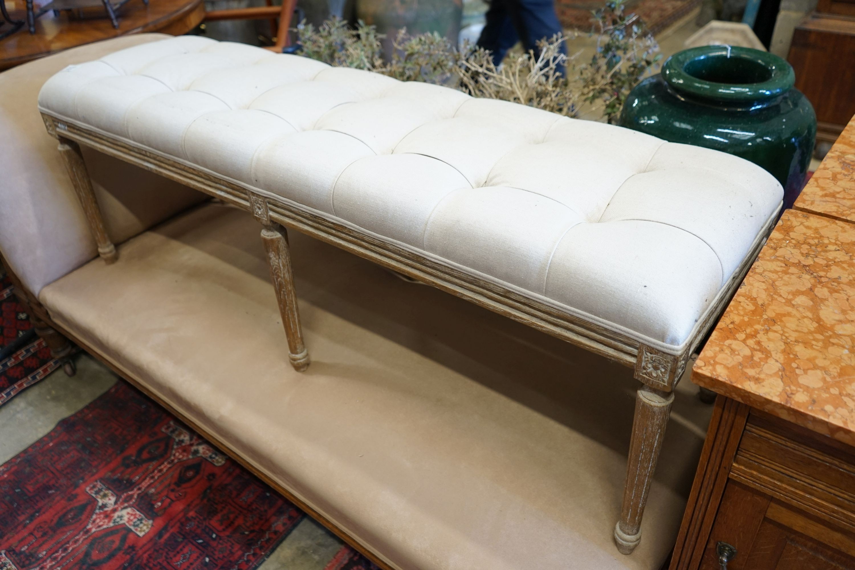 A reproduction George III style bleached window seat with buttoned natural fabric upholstery, length 140cm, depth 40cm, height 46cm